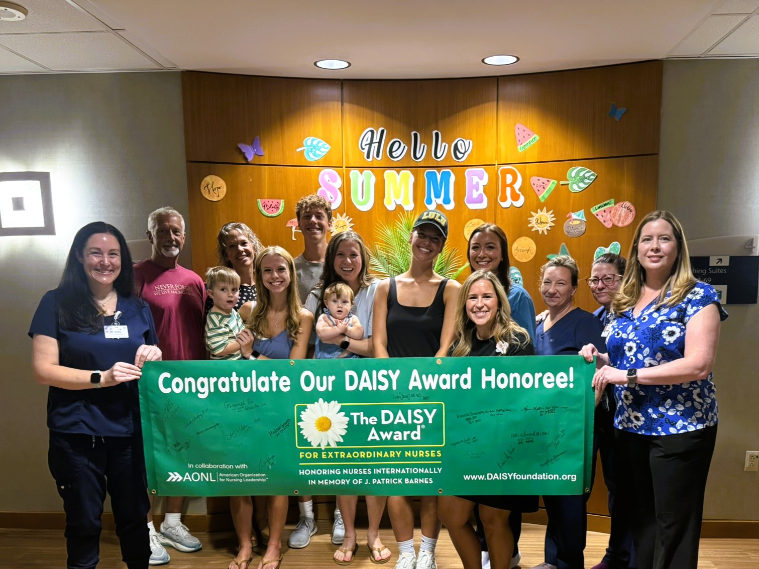 Rachel Leutkemeyer celebrates being a DAISY winner with the Fauquier Health team and family members