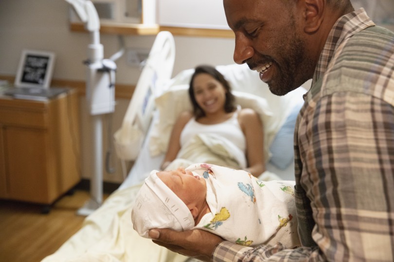 Father holding newborn Father holding newborn