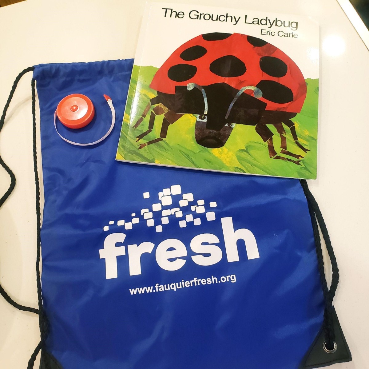 FRESH partners with Fauquier Health backpack and book 